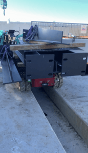 Tracked carrier transporting steel beams on the 5th floor of a high-rise construction site