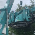 Maeda 305 spider crane lifting a Maeda 285 mini crane during a tight access job in Sydney