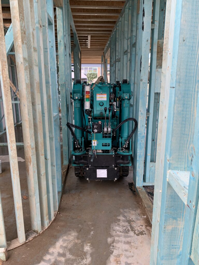 Maeda 285 mini crane travelling through a house into the backyard in Blacktown